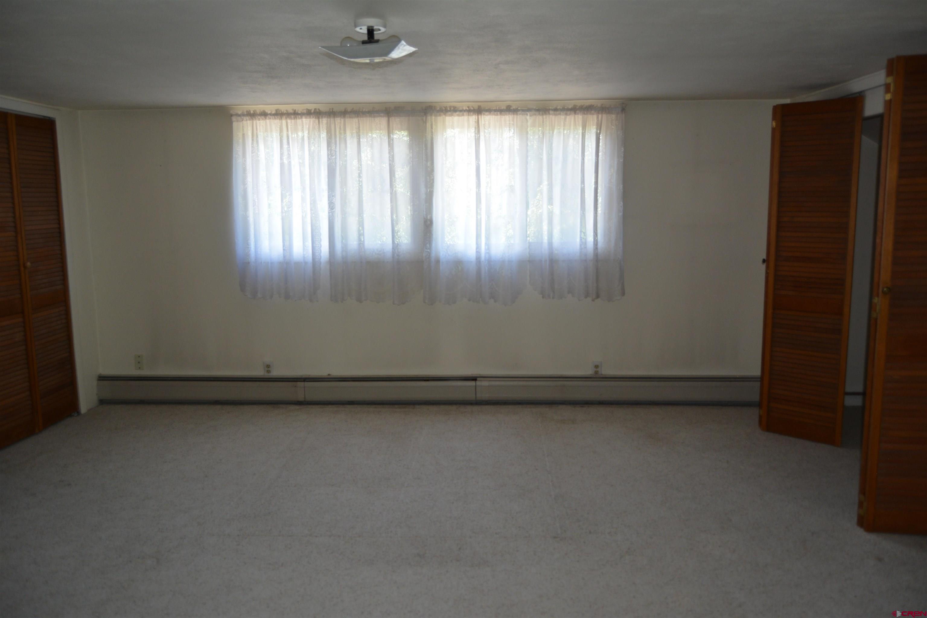 760 1575th Road Delta, CO 81416 - Photo 8 of 27 an empty room with windows