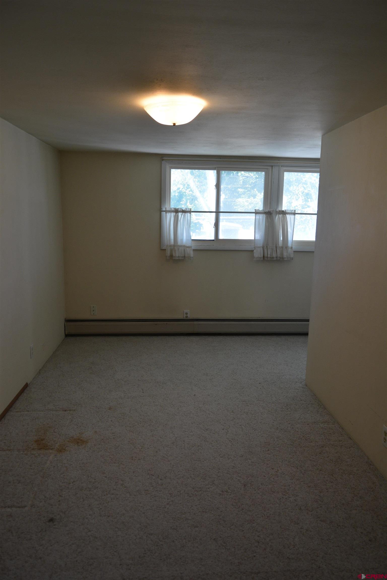 760 1575th Road Delta, CO 81416 - Photo 9 of 27 an empty room with a window