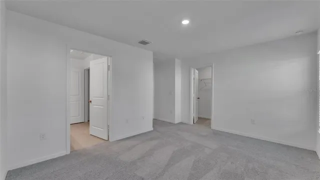an empty room with a bathroom
