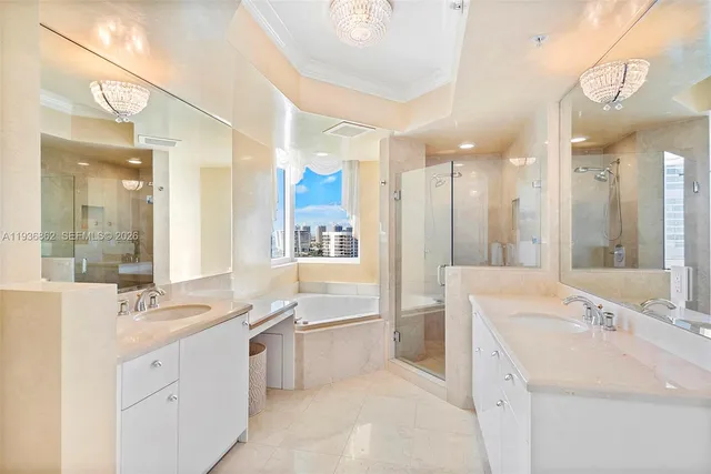 a bathroom with a sink tub shower and a mirror