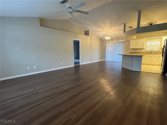 a view of a kitchen with a sink and a window