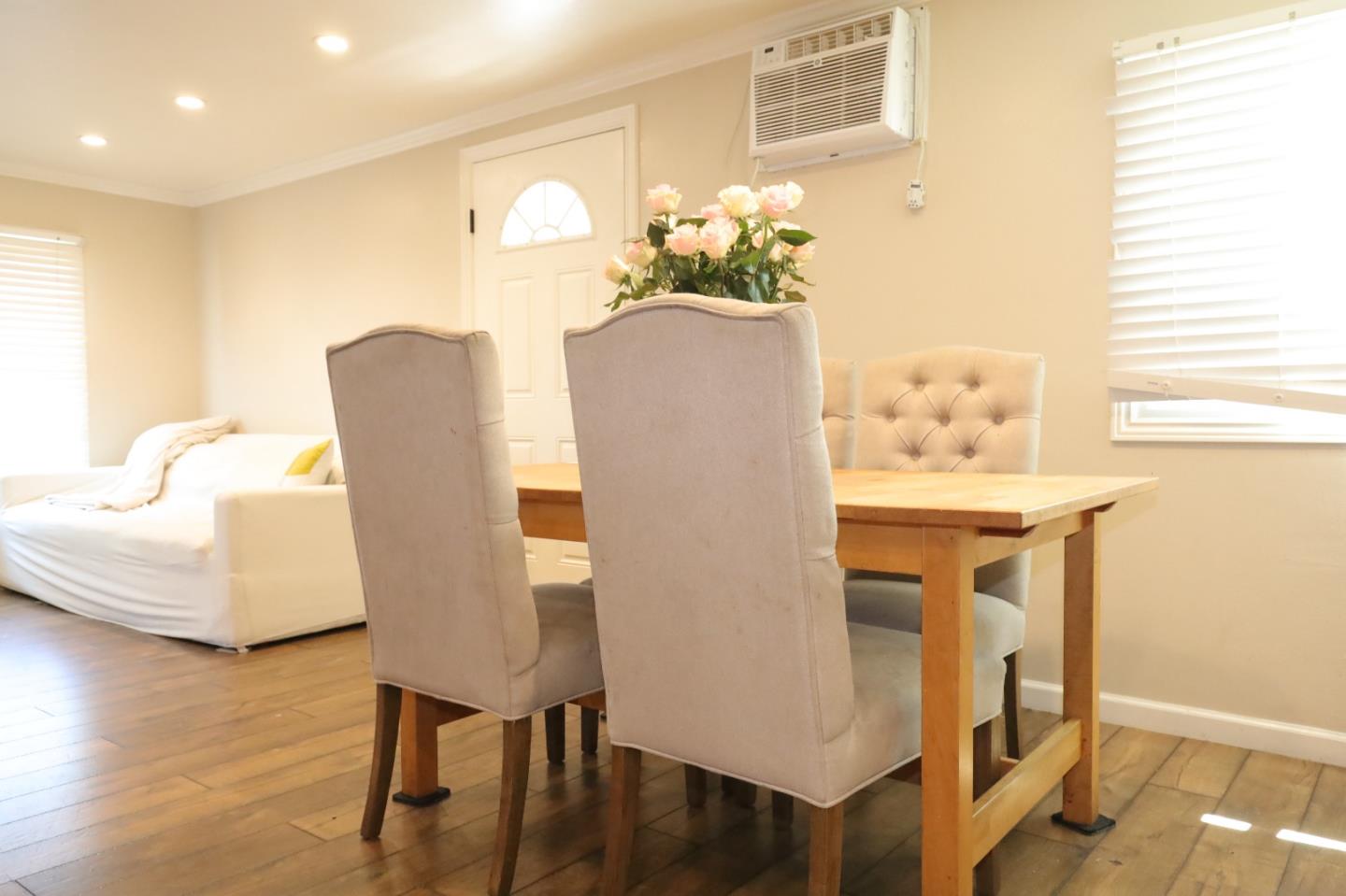 191 East El Camino Real, Unit 138 Mountain View, CA 94040 - Photo 16 of 23 a dining room with furniture and wooden floor