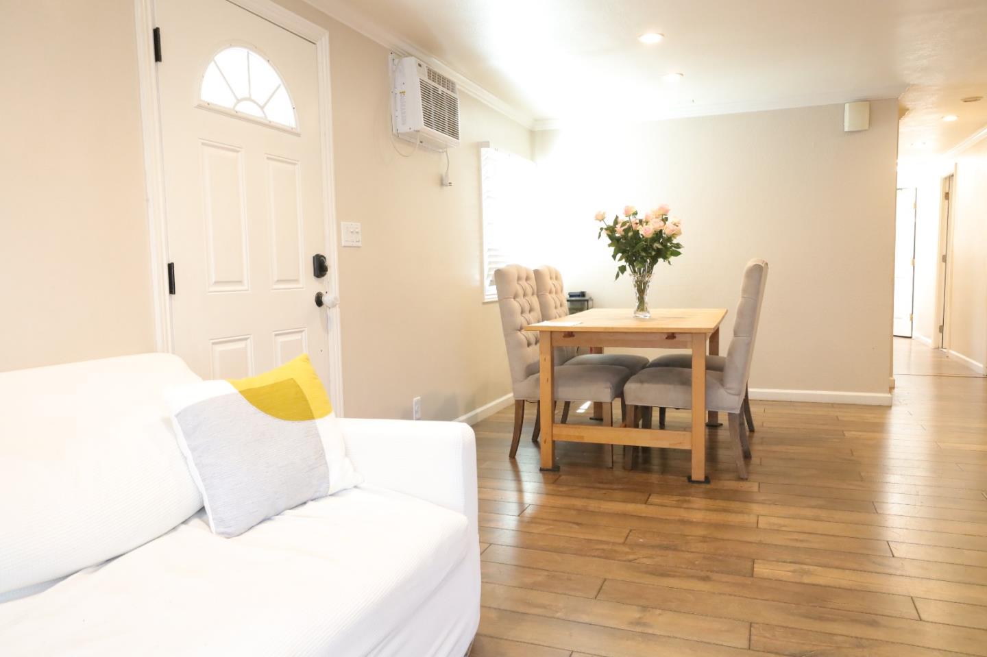 191 East El Camino Real, Unit 138 Mountain View, CA 94040 - Photo 19 of 23 a living room with furniture and wooden floor
