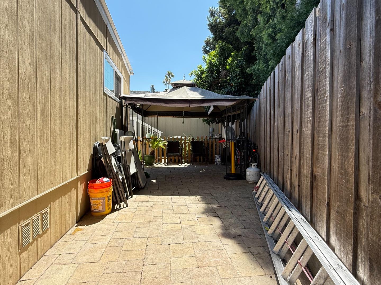 191 East El Camino Real, Unit 138 Mountain View, CA 94040 - Photo 22 of 23 a view of path along with wooden deck and outdoor seating
