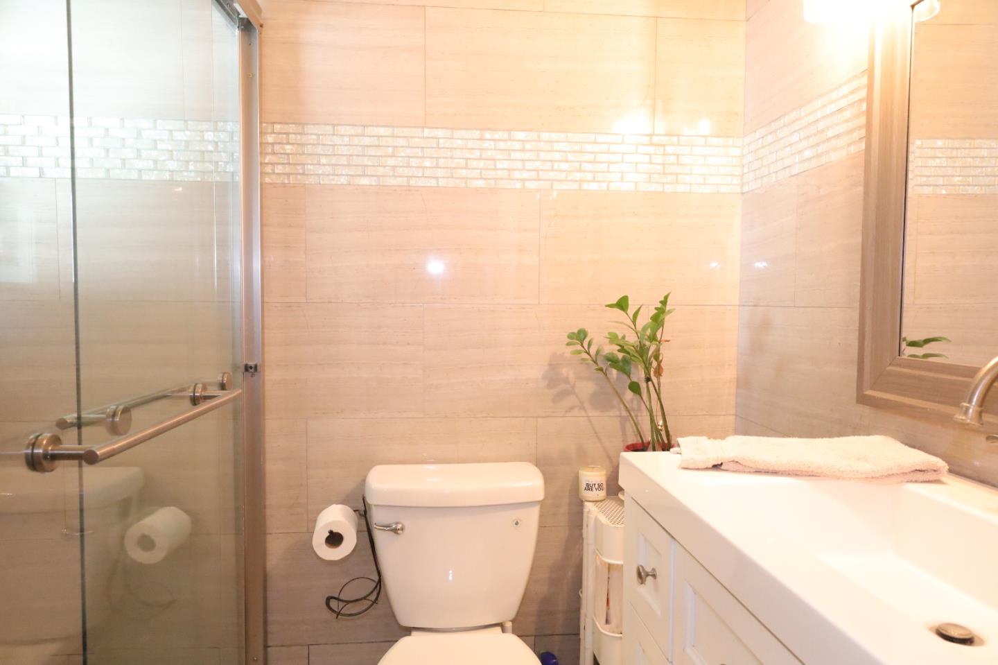 191 East El Camino Real, Unit 138 Mountain View, CA 94040 - Photo 4 of 23 a bathroom with a sink a toilet and shower