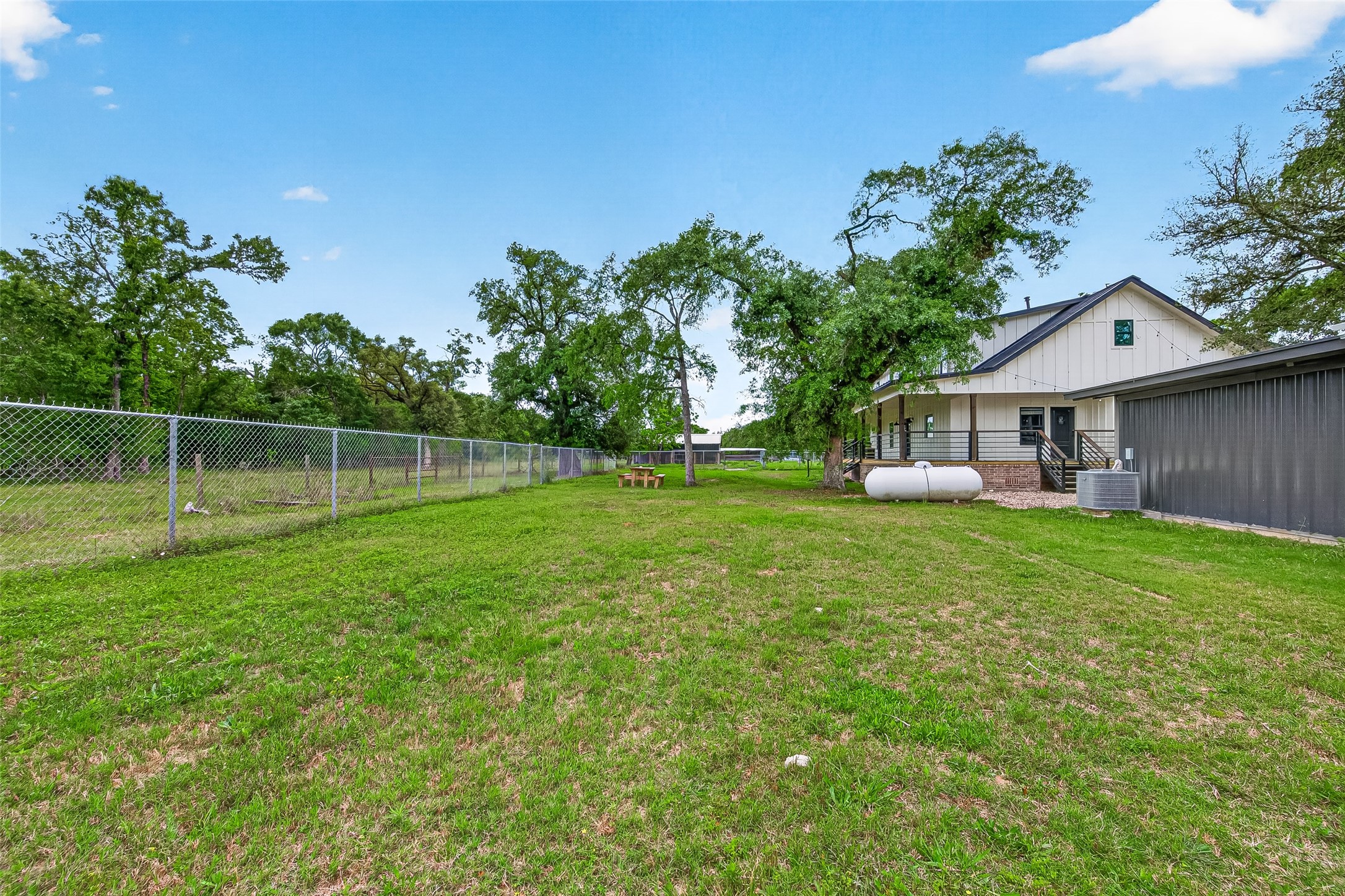 803 County Road 772 Damon, TX 77430 - Photo 41 of 50 a view of a house with backyard and sitting area