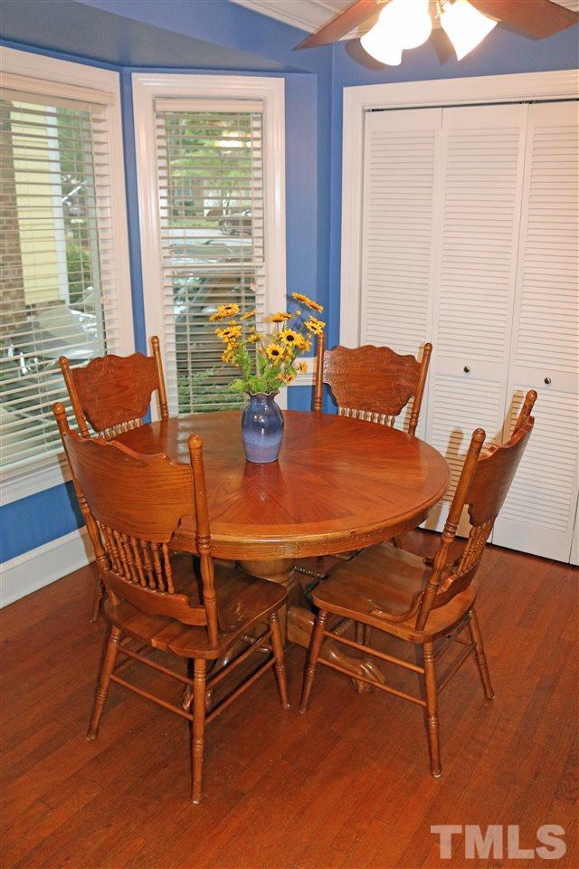4508 Tetbury Place Raleigh, NC 27613 - Photo 12 of 22 a view of a dining room with furniture and a window