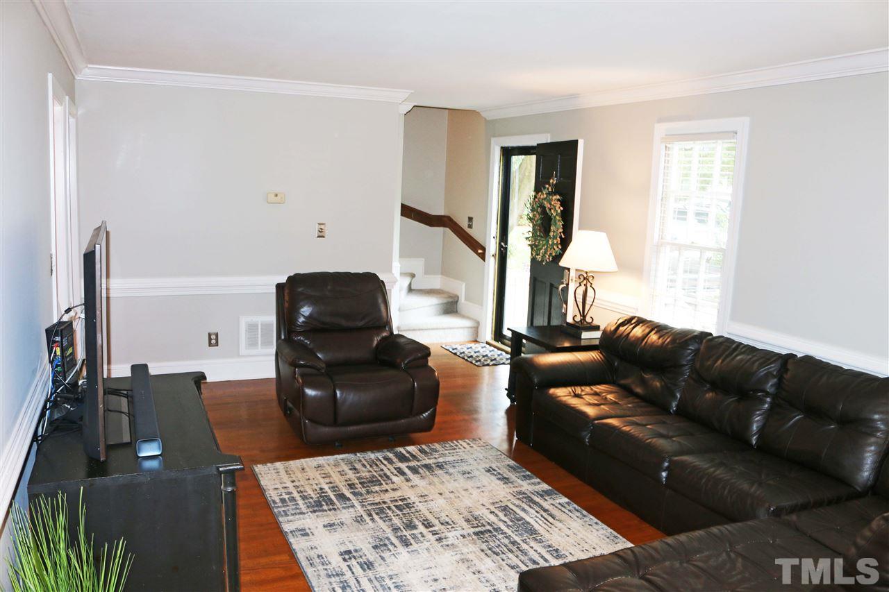 4508 Tetbury Place Raleigh, NC 27613 - Photo 7 of 22 a living room with furniture and a window