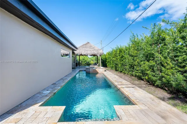 a view of a backyard with potted plants