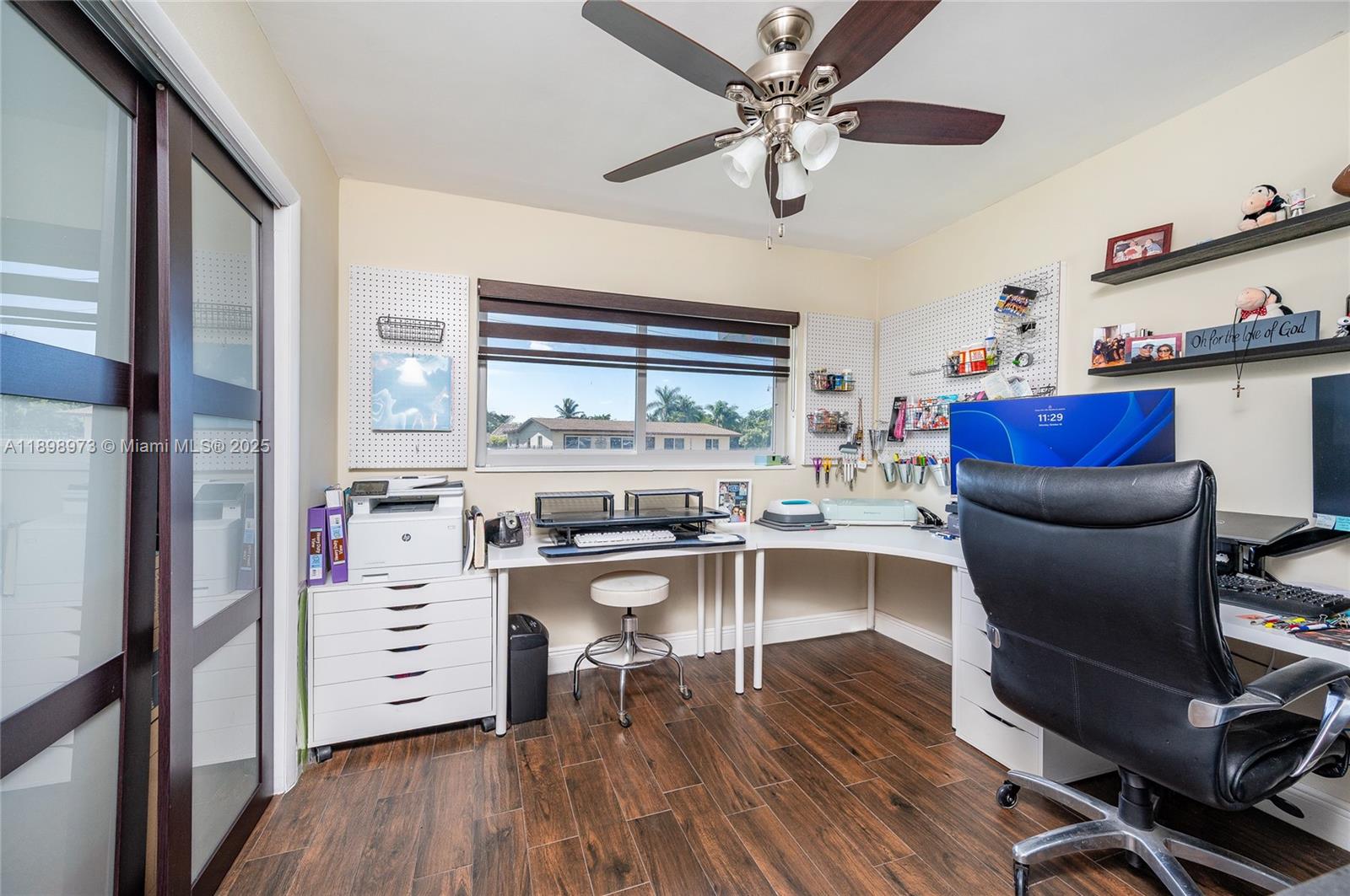 10341 Southwest 52nd Terrace Miami, FL 33165 - Photo 23 of 32 a view of a workspace with furniture and wooden floor