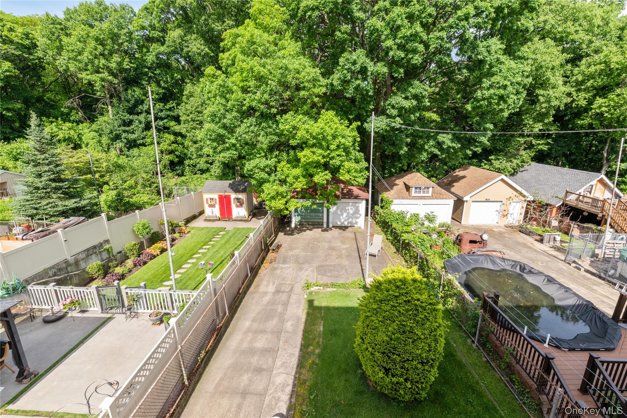 82-72 88th Place Queens, NY 11421 - Photo 3 of 26 an aerial view of a house with a garden