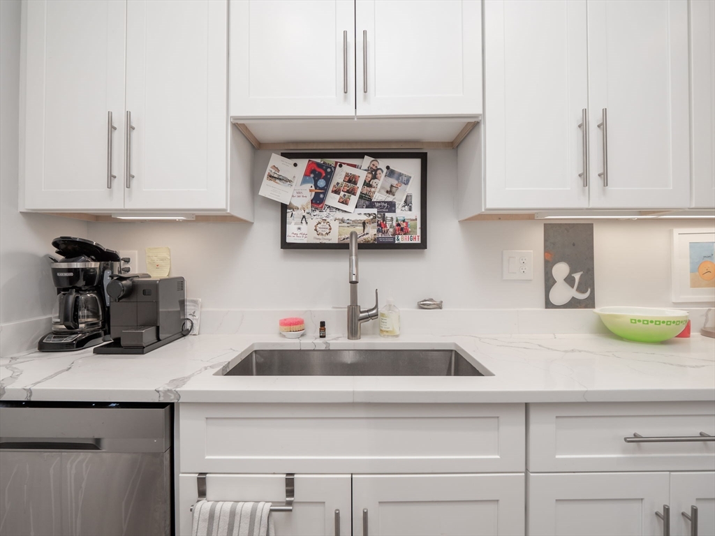 45 L Street, Unit 2 Boston, MA 02127 - Photo 11 of 31 a kitchen with a sink and cabinets