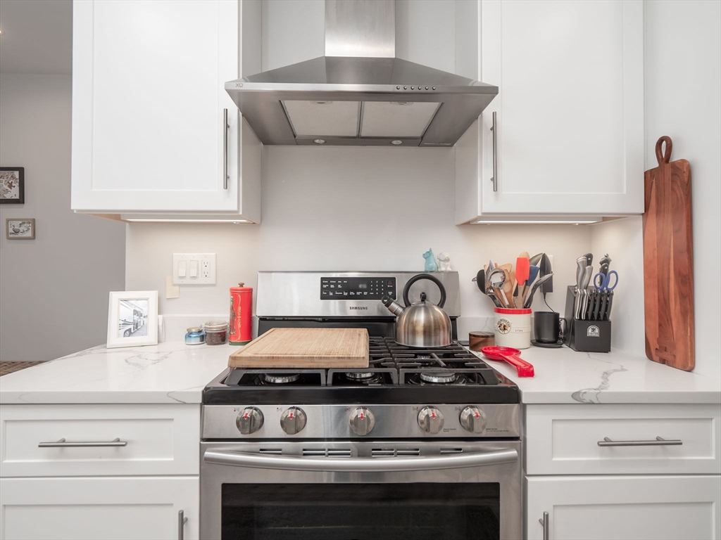45 L Street, Unit 2 Boston, MA 02127 - Photo 12 of 31 a stove top oven sitting inside of a kitchen