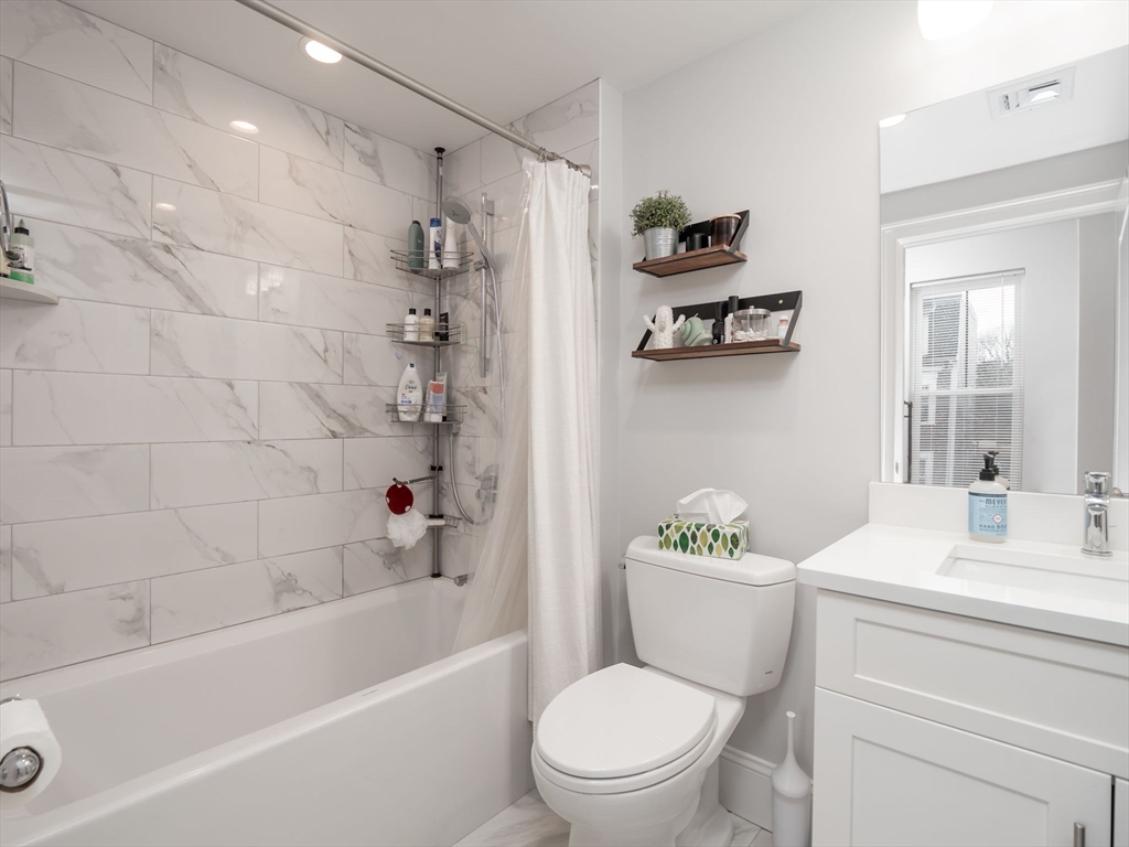 45 L Street, Unit 2 Boston, MA 02127 - Photo 17 of 31 a bathroom with a sink a toilet and a bathtub