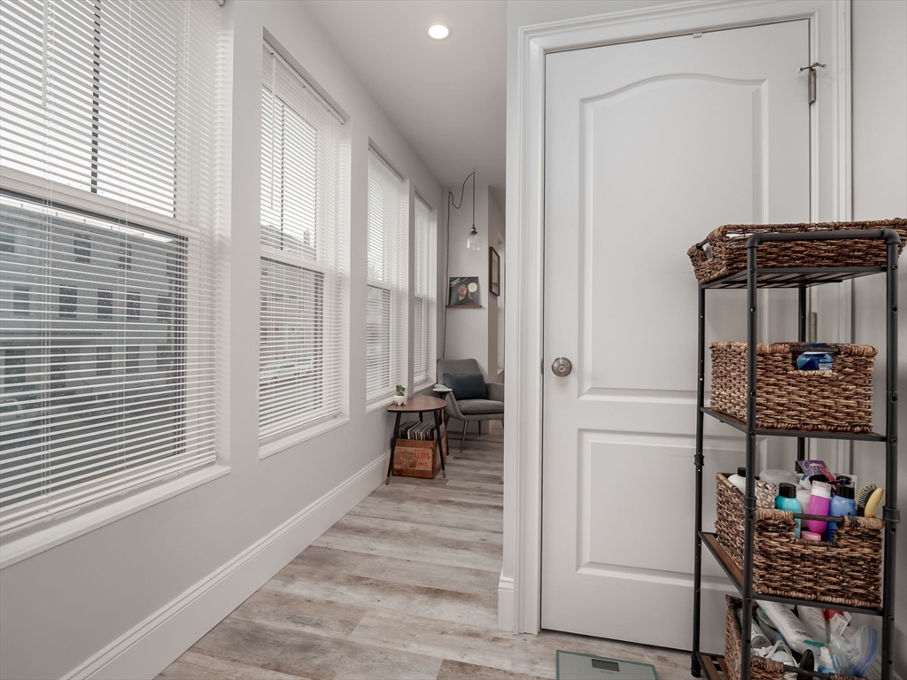 45 L Street, Unit 2 Boston, MA 02127 - Photo 18 of 31 a view of a hallway with a window and couch