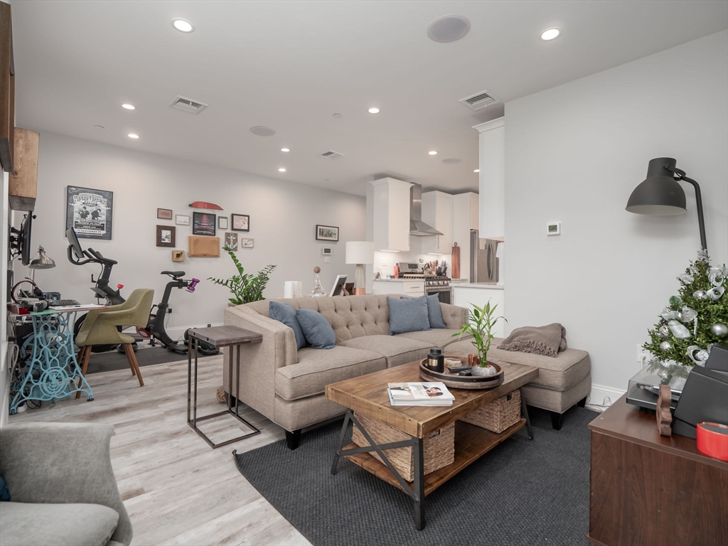 45 L Street, Unit 2 Boston, MA 02127 - Photo 2 of 31 a living room with furniture and flowers