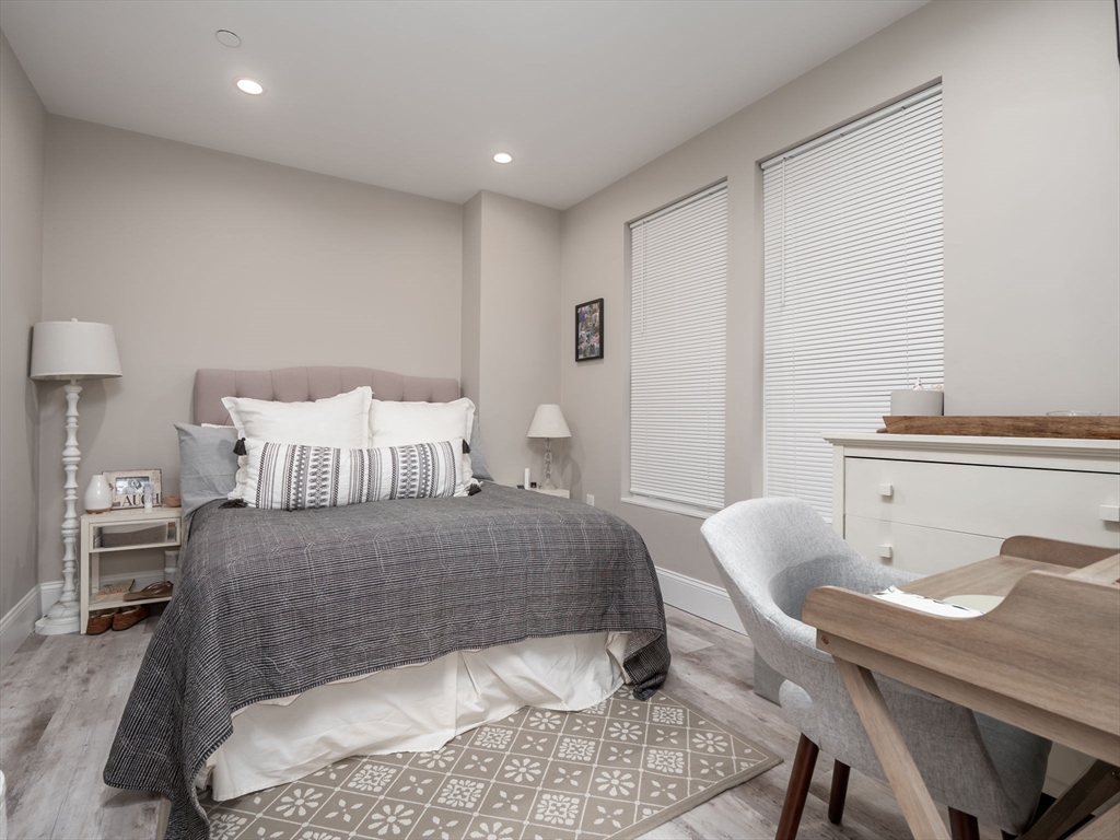 45 L Street, Unit 2 Boston, MA 02127 - Photo 10 of 31 a bedroom with a bed and a table