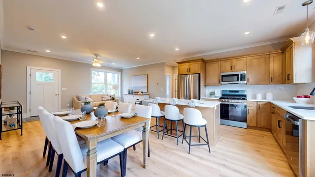 a large kitchen with a table and chairs