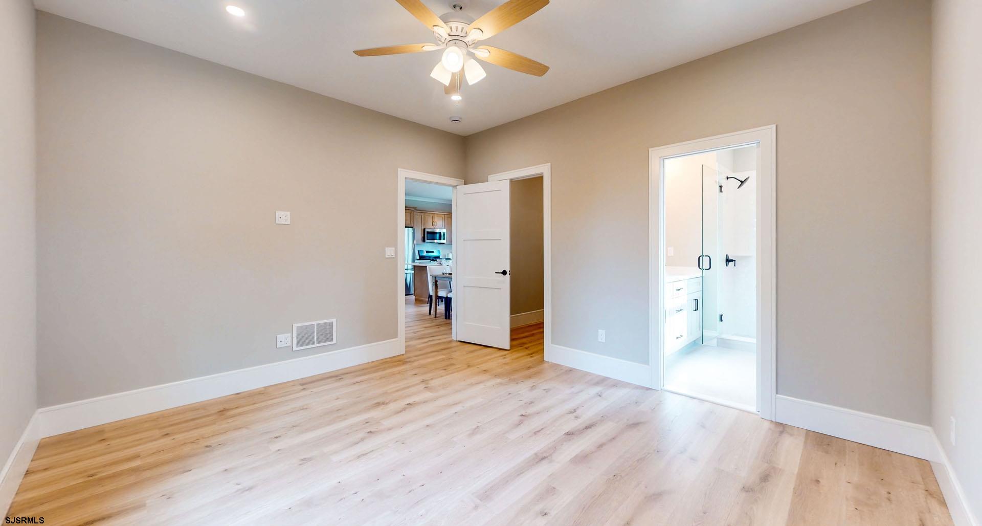1729 Shore Road Ocean View, NJ 08230 - Photo 16 of 36 wooden floor in an empty room with a window