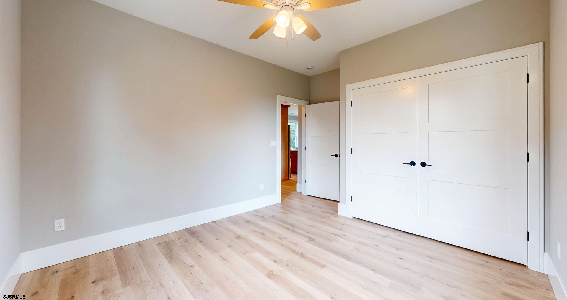 1729 Shore Road Ocean View, NJ 08230 - Photo 21 of 36 wooden floor in an empty room with a window