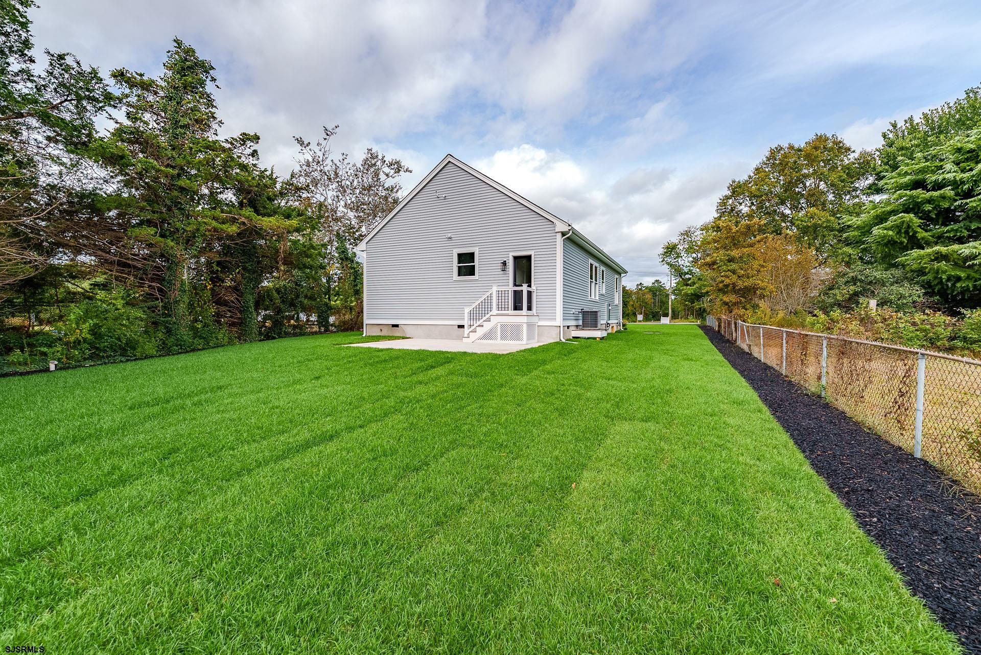 1729 Shore Road Ocean View, NJ 08230 - Photo 25 of 36 a view of a house with a yard and pathway