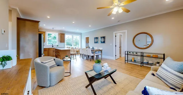 a living room with furniture a rug and a window