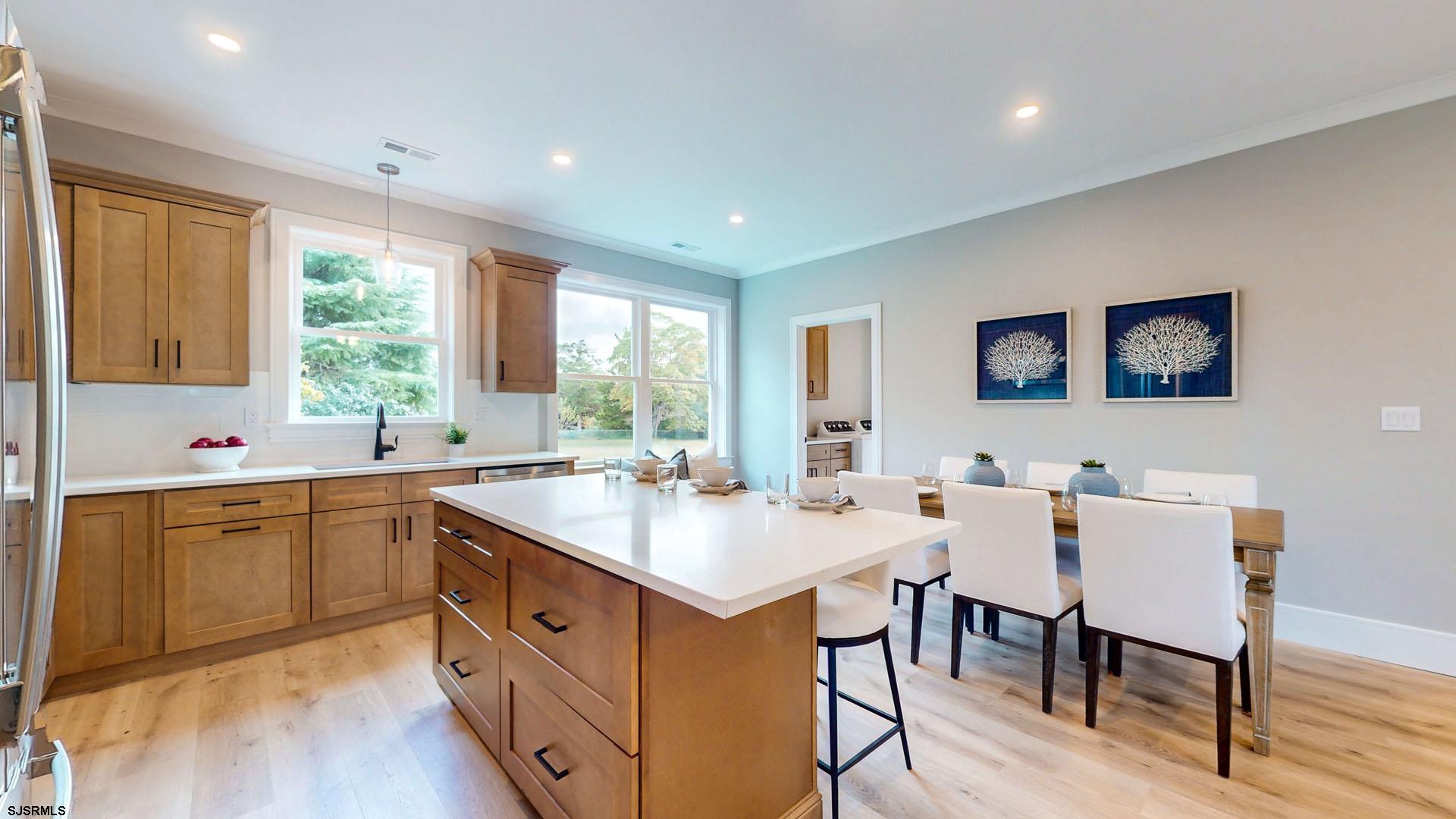 1729 Shore Road Ocean View, NJ 08230 - Photo 9 of 36 a kitchen with a table chairs sink and cabinets