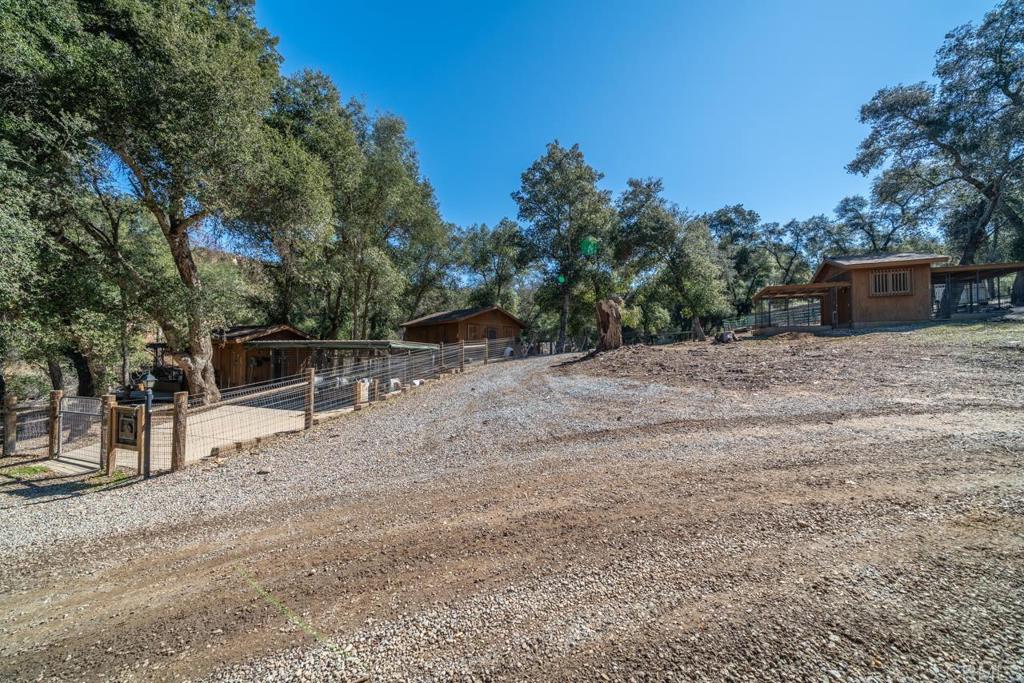 26352 Eagle Gap Road Santa Ysabel, CA 92070 - Photo 37 of 52 a backyard of a house with trees and outdoor space