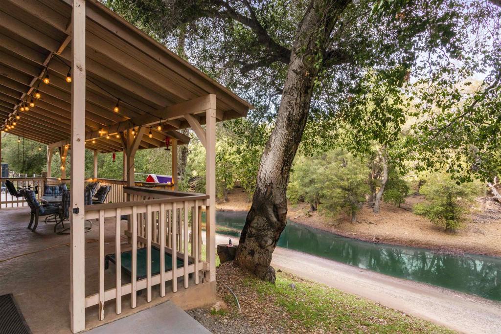 26352 Eagle Gap Road Santa Ysabel, CA 92070 - Photo 5 of 52 a view of a patio with table and chairs and a large tree
