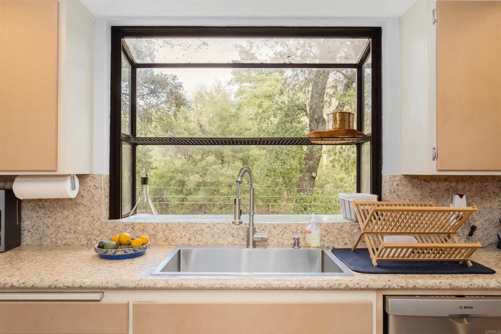 26352 Eagle Gap Road Santa Ysabel, CA 92070 - Photo 8 of 52 a kitchen with granite countertop a window and a counter space