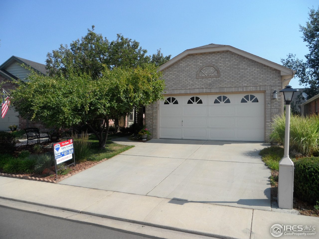 a front view of a house with garage