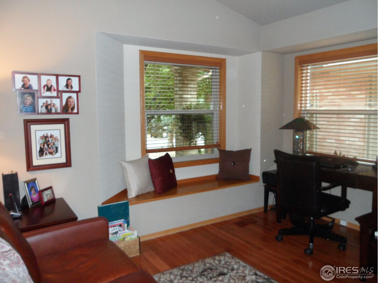 724 Wade Road Longmont, CO 80503 - Photo 14 of 32 a living room with furniture and a window
