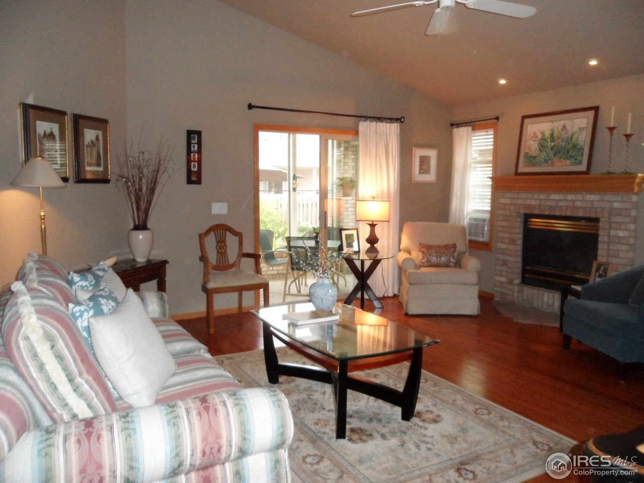 724 Wade Road Longmont, CO 80503 - Photo 7 of 32 a living room with furniture fireplace and window
