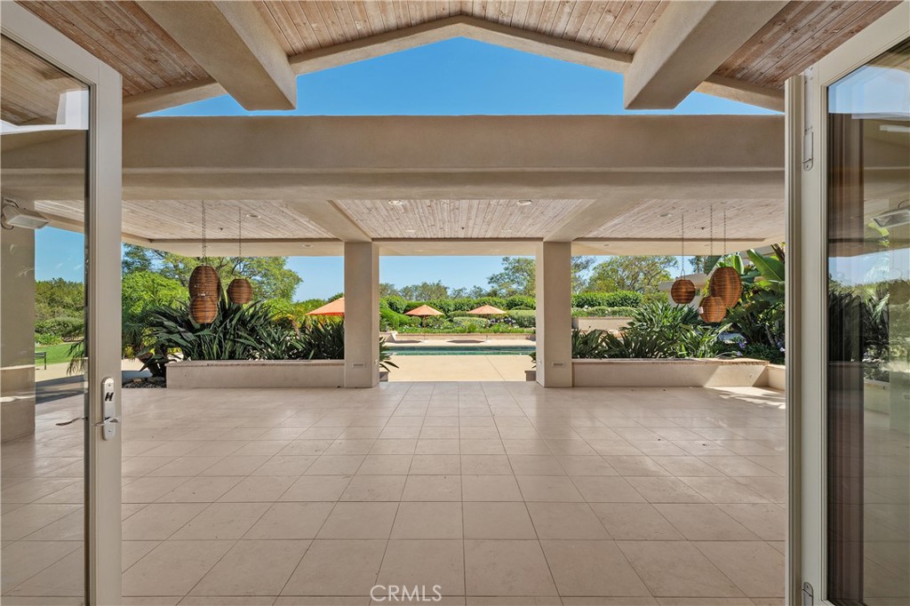 6533 Lago Lindo Rancho Santa Fe, CA 92067 - Photo 42 of 57 Family room nano doors open onto covered patio