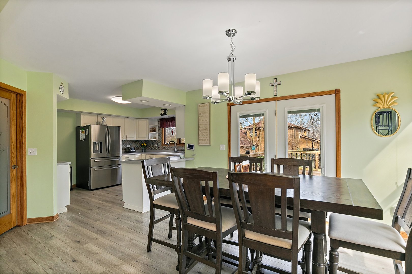 8911 Burton Road Wonder Lake, IL 60097 - Photo 12 of 35 a view of a dining room with furniture wooden floor and chandelier