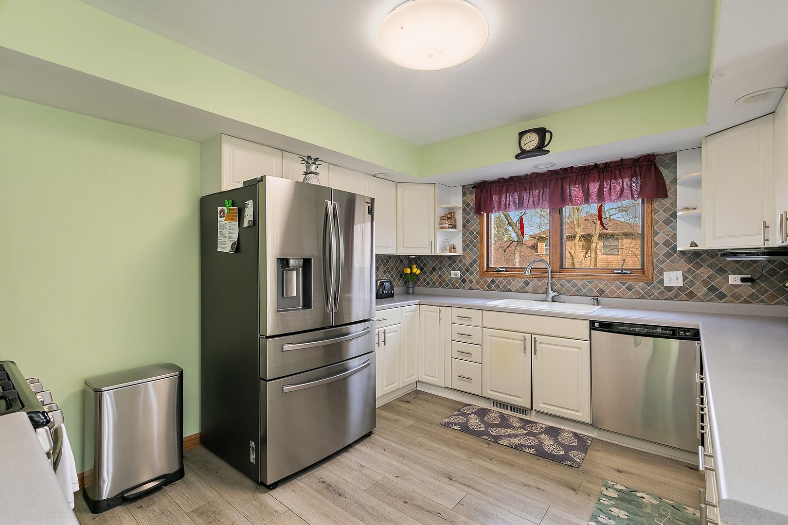 8911 Burton Road Wonder Lake, IL 60097 - Photo 14 of 35 a kitchen with granite countertop a refrigerator stove top oven and sink