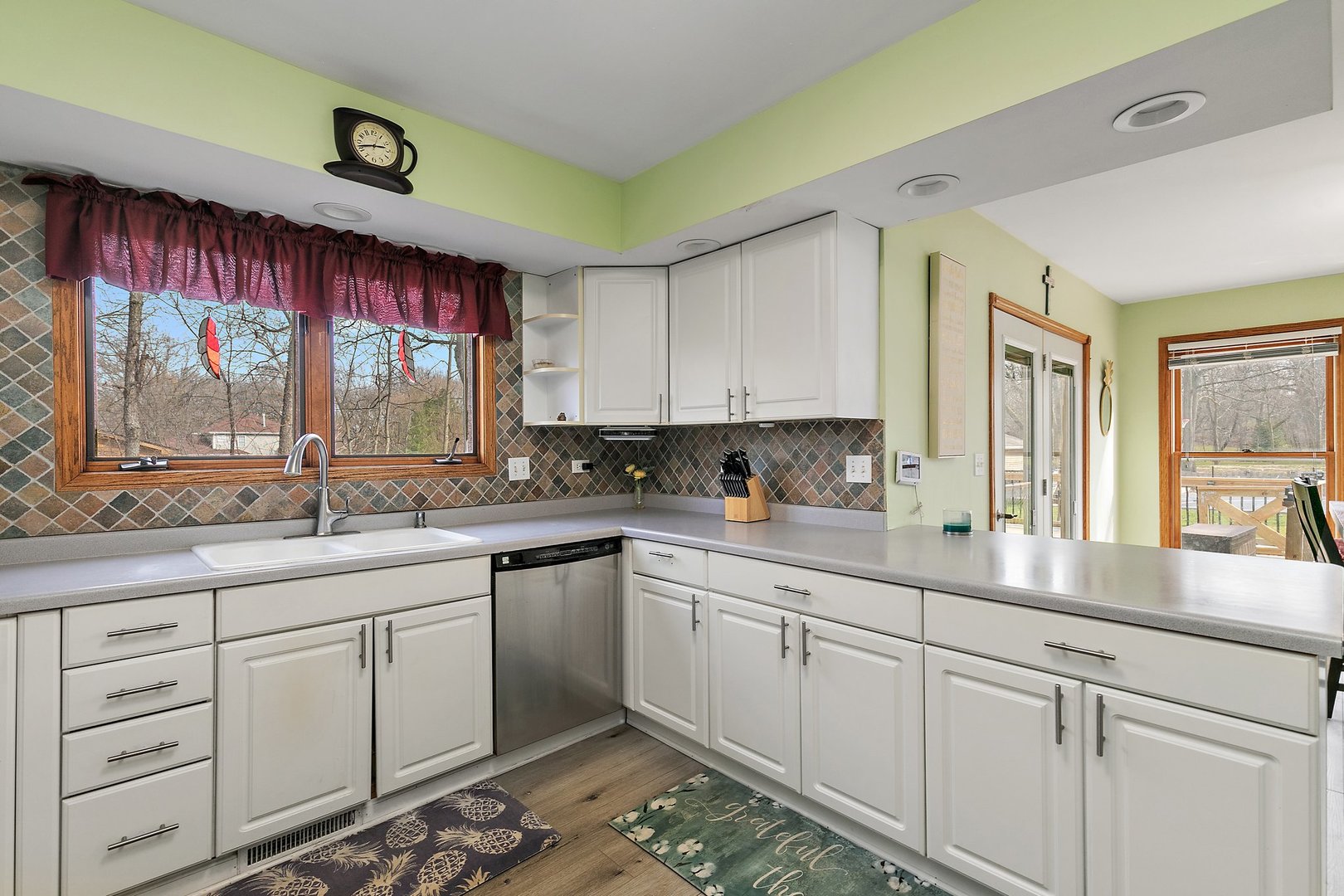 8911 Burton Road Wonder Lake, IL 60097 - Photo 15 of 35 a kitchen with white cabinets and window