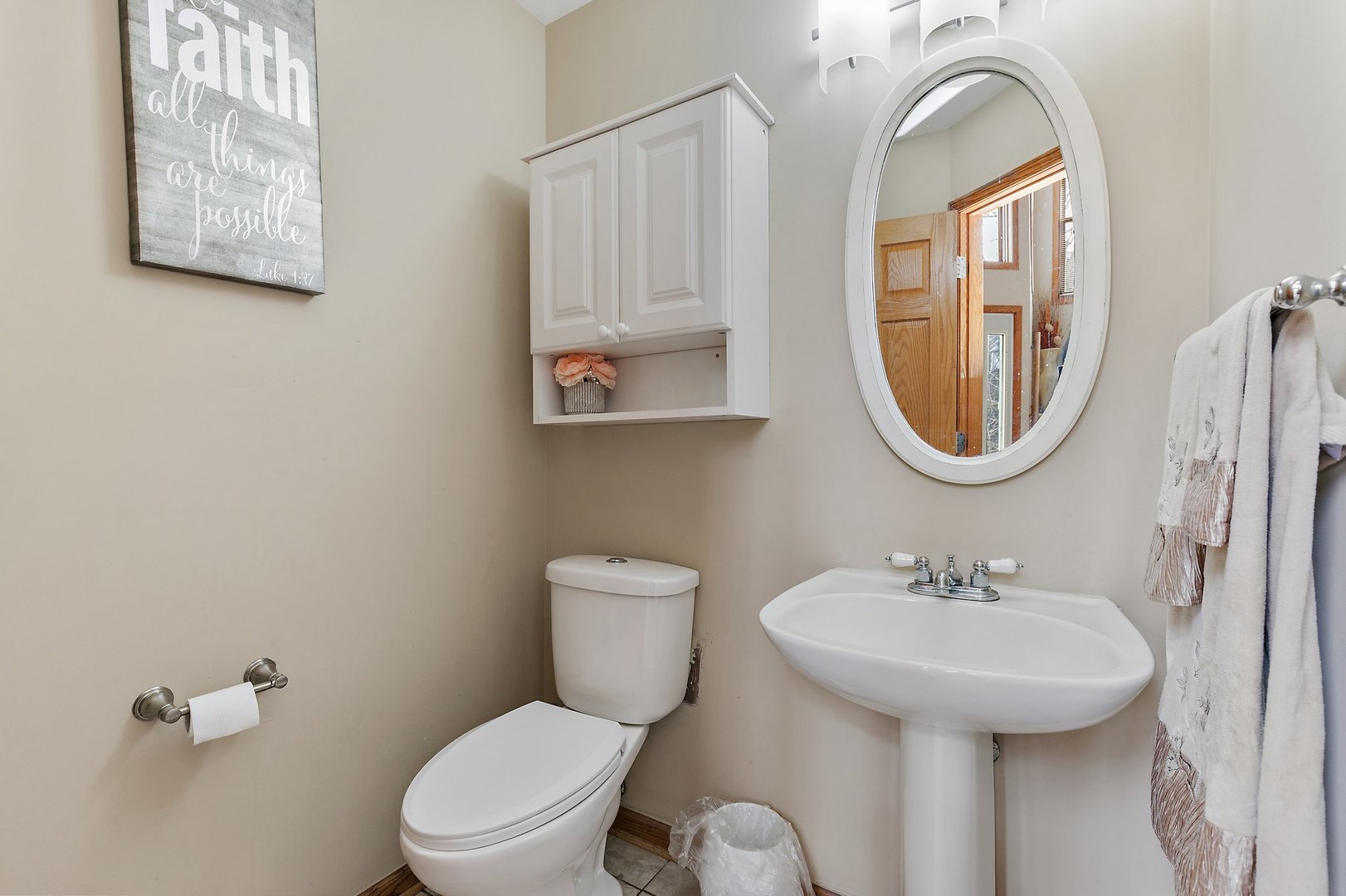8911 Burton Road Wonder Lake, IL 60097 - Photo 19 of 35 a bathroom with a toilet sink and mirror