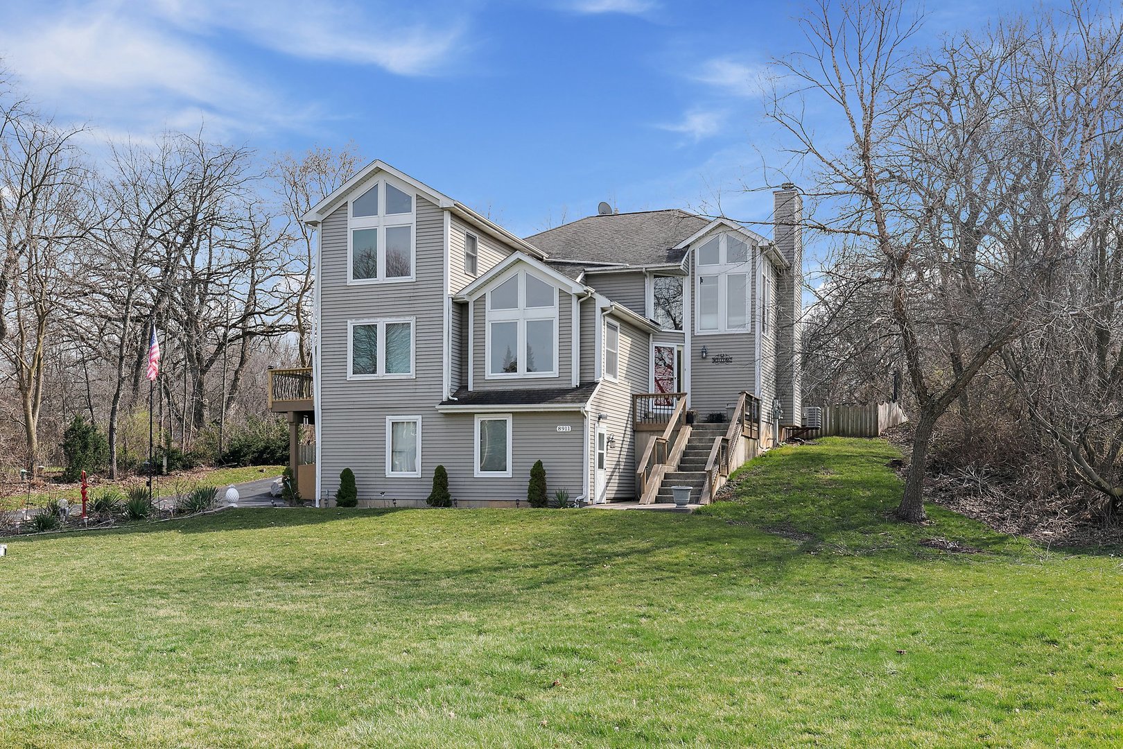8911 Burton Road Wonder Lake, IL 60097 - Photo 2 of 35 a view of a house with a yard