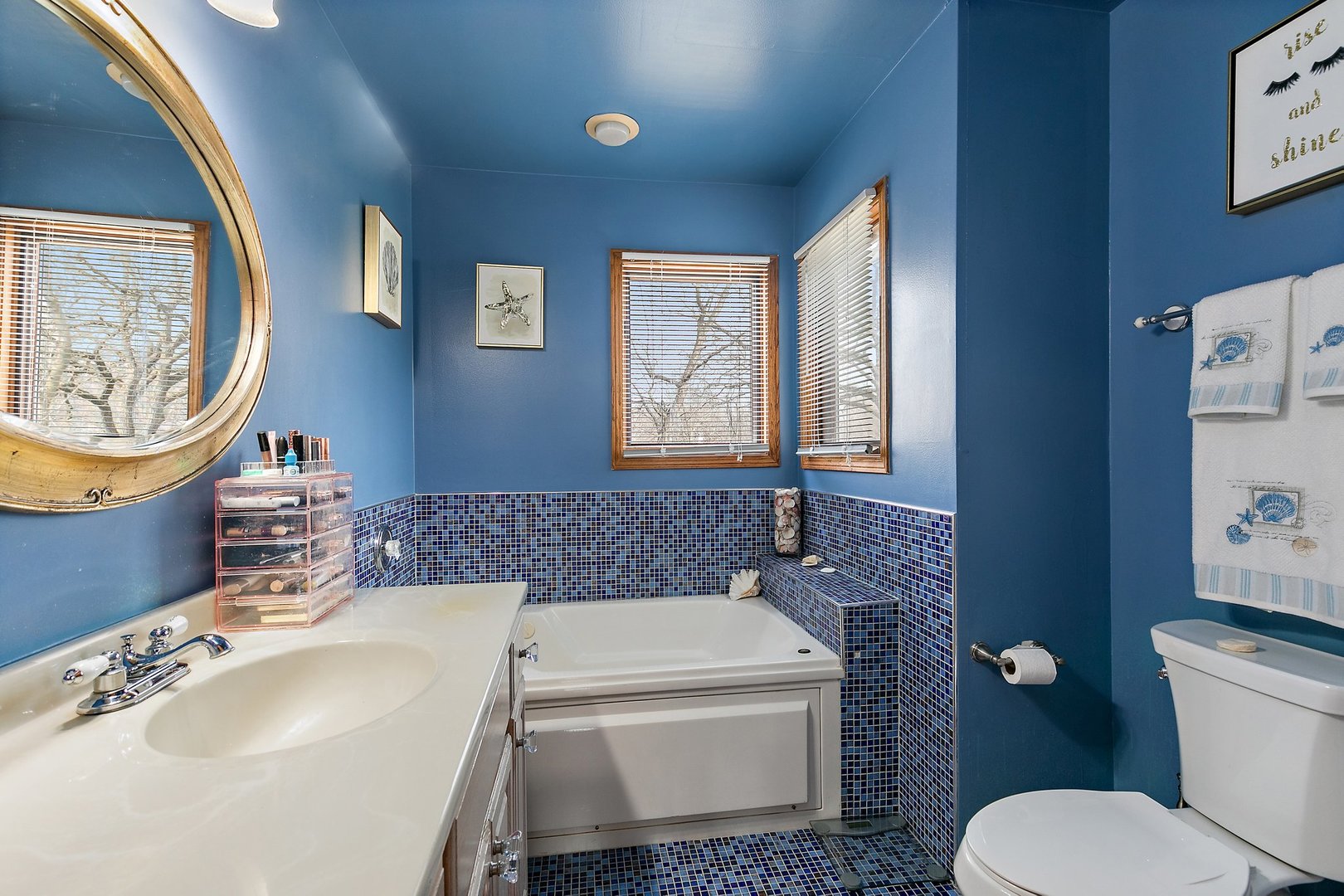 8911 Burton Road Wonder Lake, IL 60097 - Photo 27 of 35 a bathroom with a toilet a sink and a bathtub