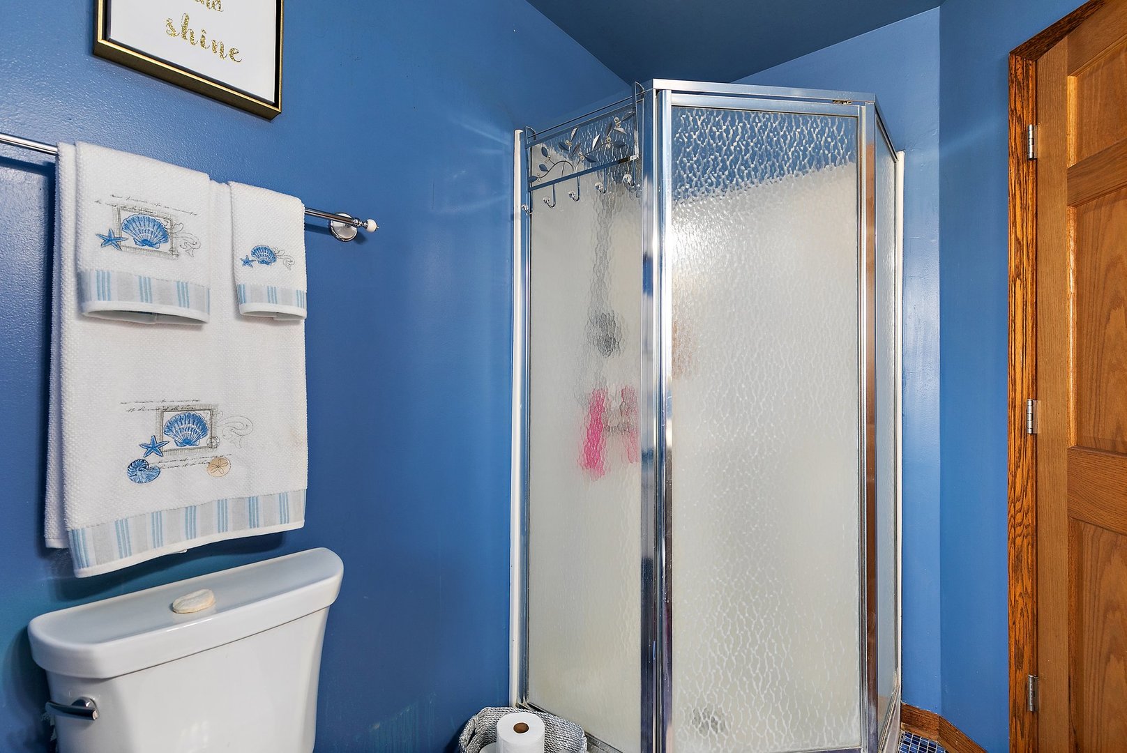 8911 Burton Road Wonder Lake, IL 60097 - Photo 28 of 35 a bathroom with a toilet and a shower curtain