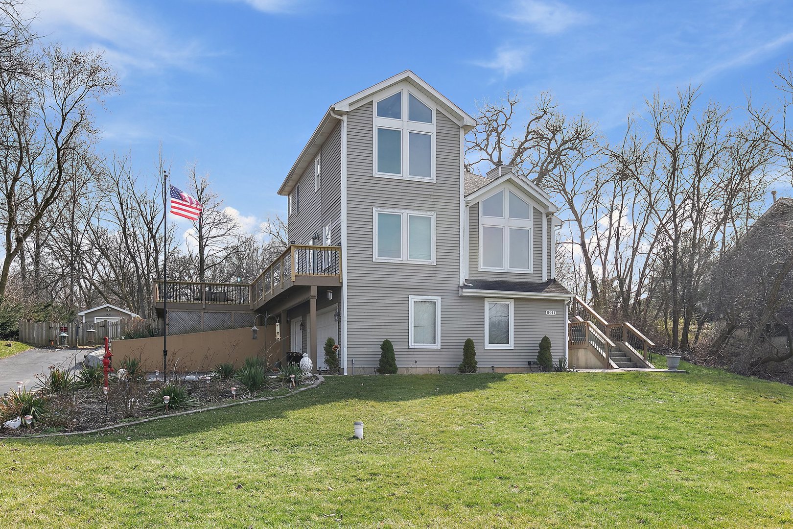 8911 Burton Road Wonder Lake, IL 60097 - Photo 3 of 35 a front view of a house with a yard