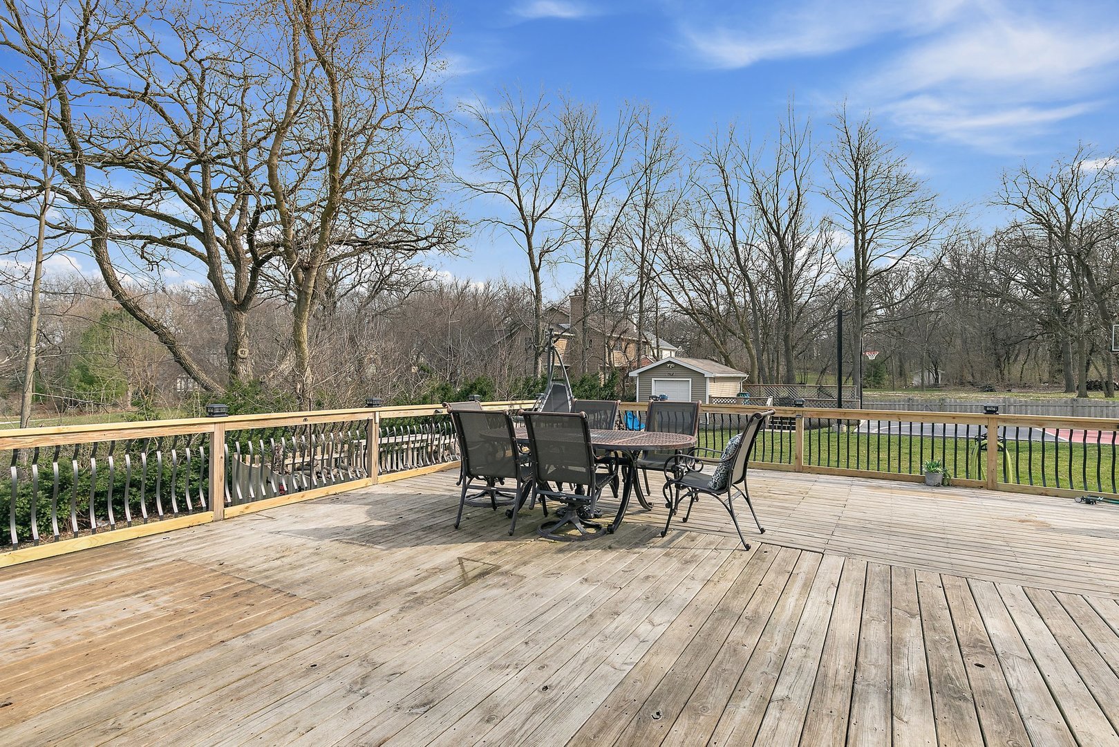 8911 Burton Road Wonder Lake, IL 60097 - Photo 31 of 35 a view of a roof deck with table and chairs and wooden floor