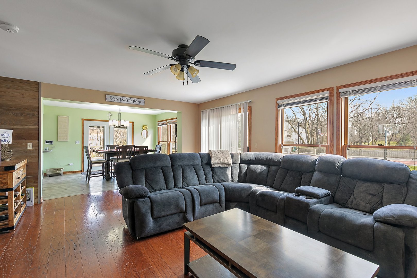 8911 Burton Road Wonder Lake, IL 60097 - Photo 9 of 35 a living room with furniture and a large window