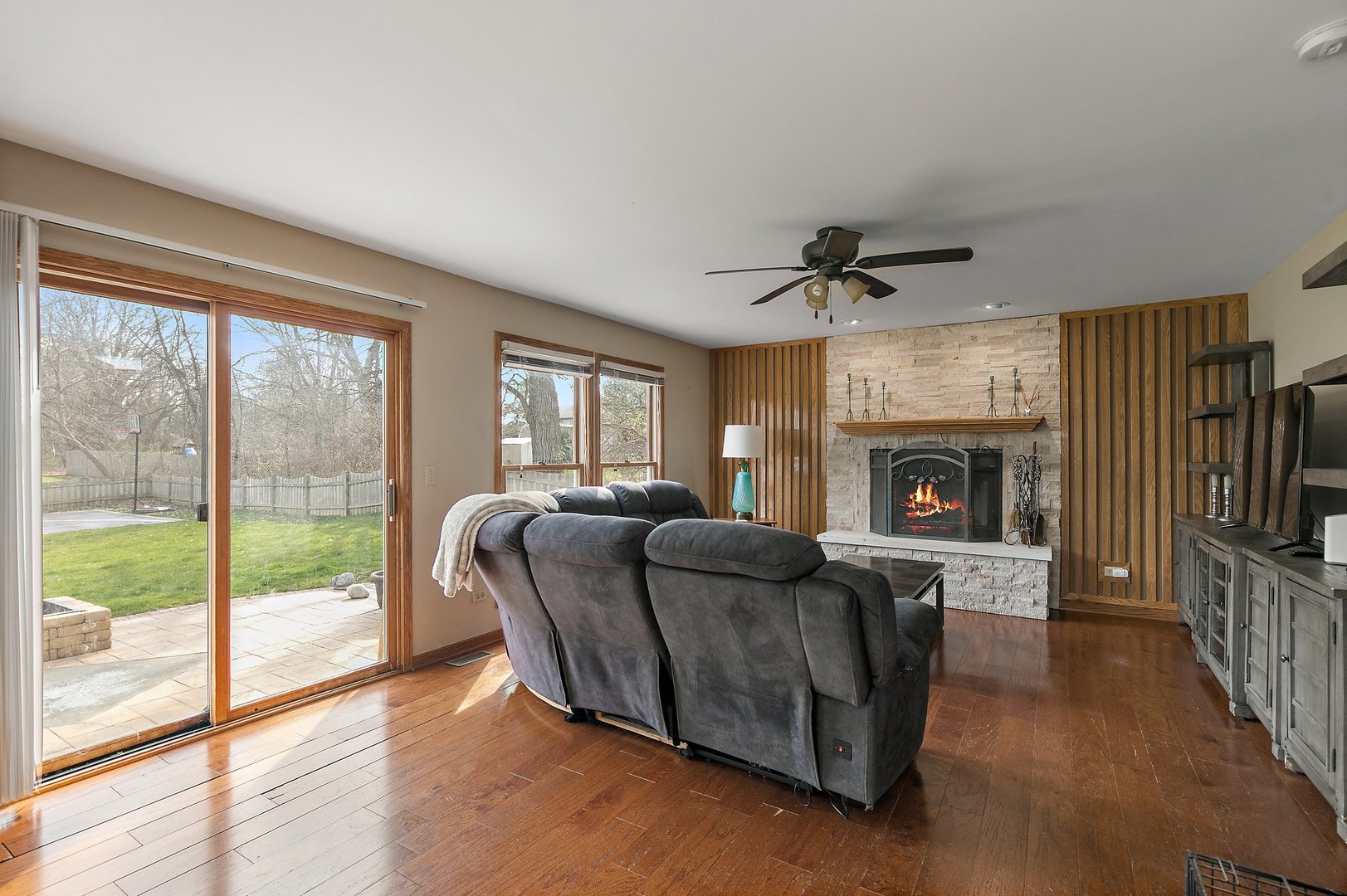 8911 Burton Road Wonder Lake, IL 60097 - Photo 10 of 35 a living room with furniture and a fireplace