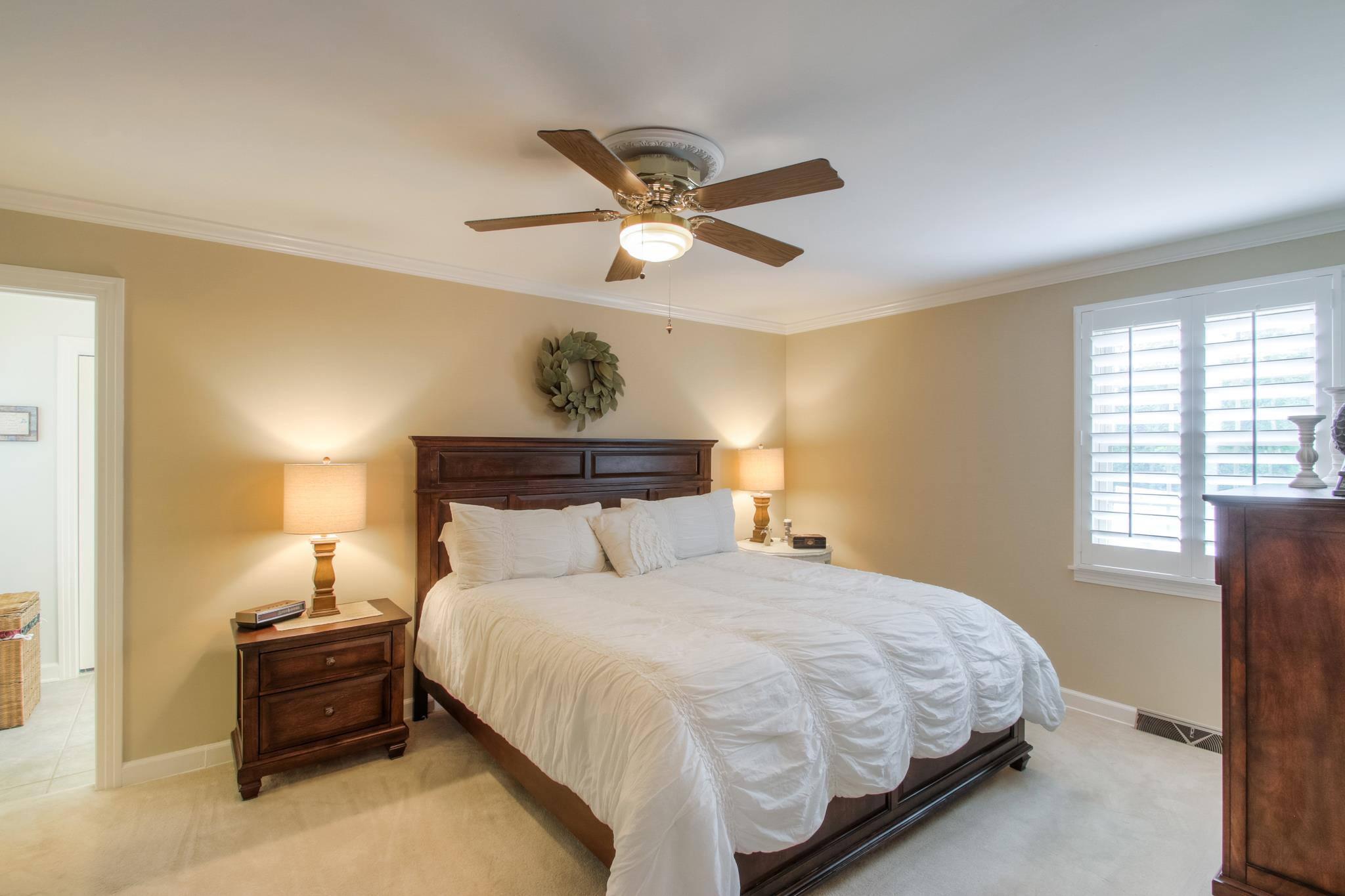 1160 Vanderbilt Road Mount Juliet, TN 37122 - Photo 12 of 28 a bedroom with a bed and a chandelier