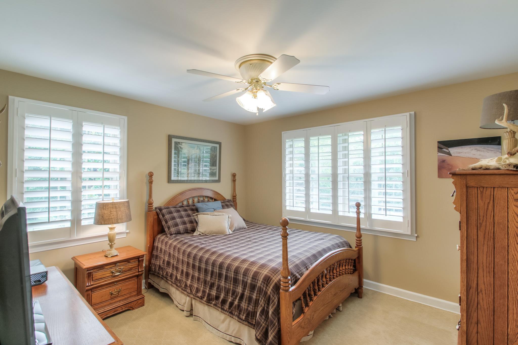 1160 Vanderbilt Road Mount Juliet, TN 37122 - Photo 17 of 28 a bedroom with a bed and a chandelier