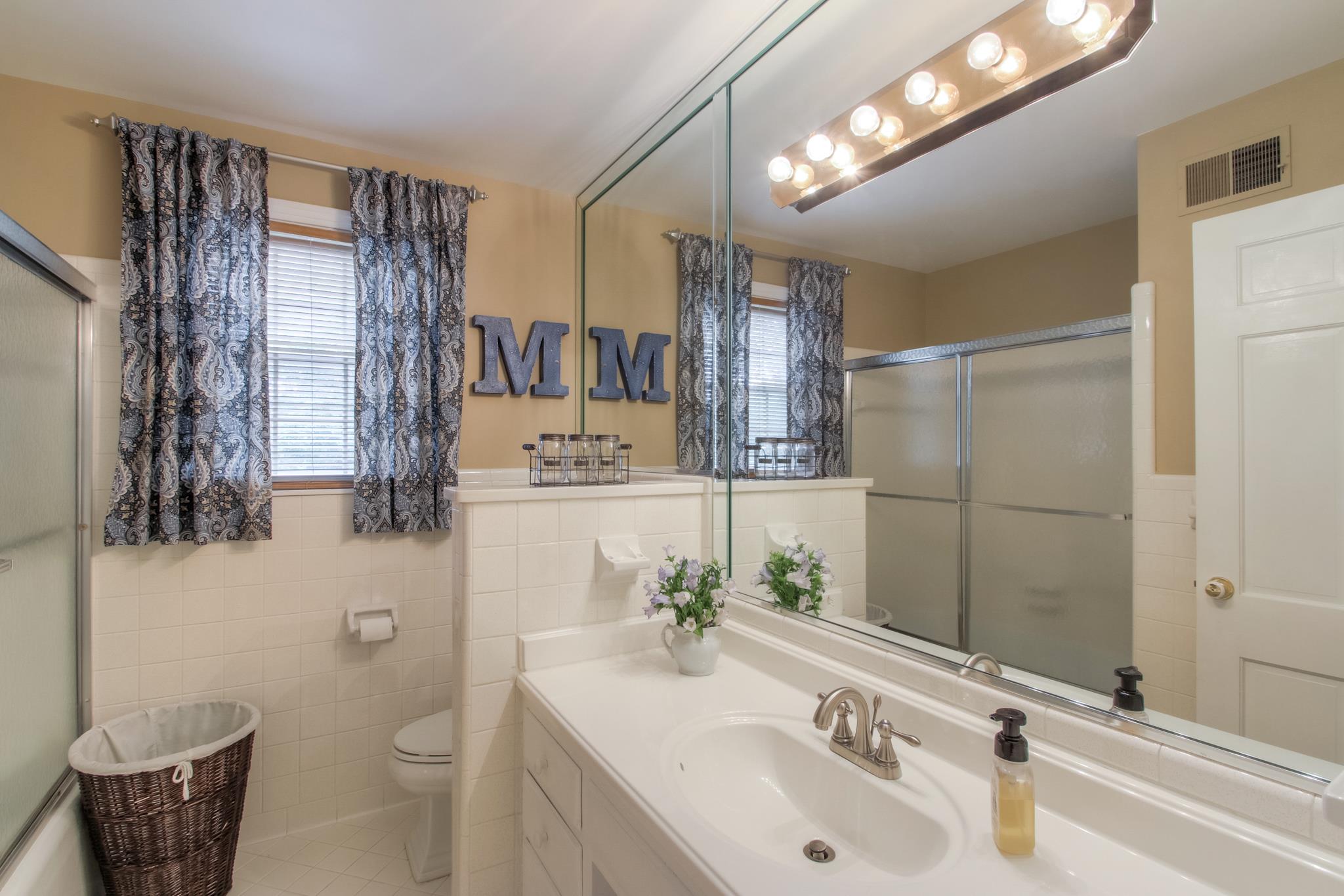 1160 Vanderbilt Road Mount Juliet, TN 37122 - Photo 18 of 28 a bathroom with a sink toilet and shower
