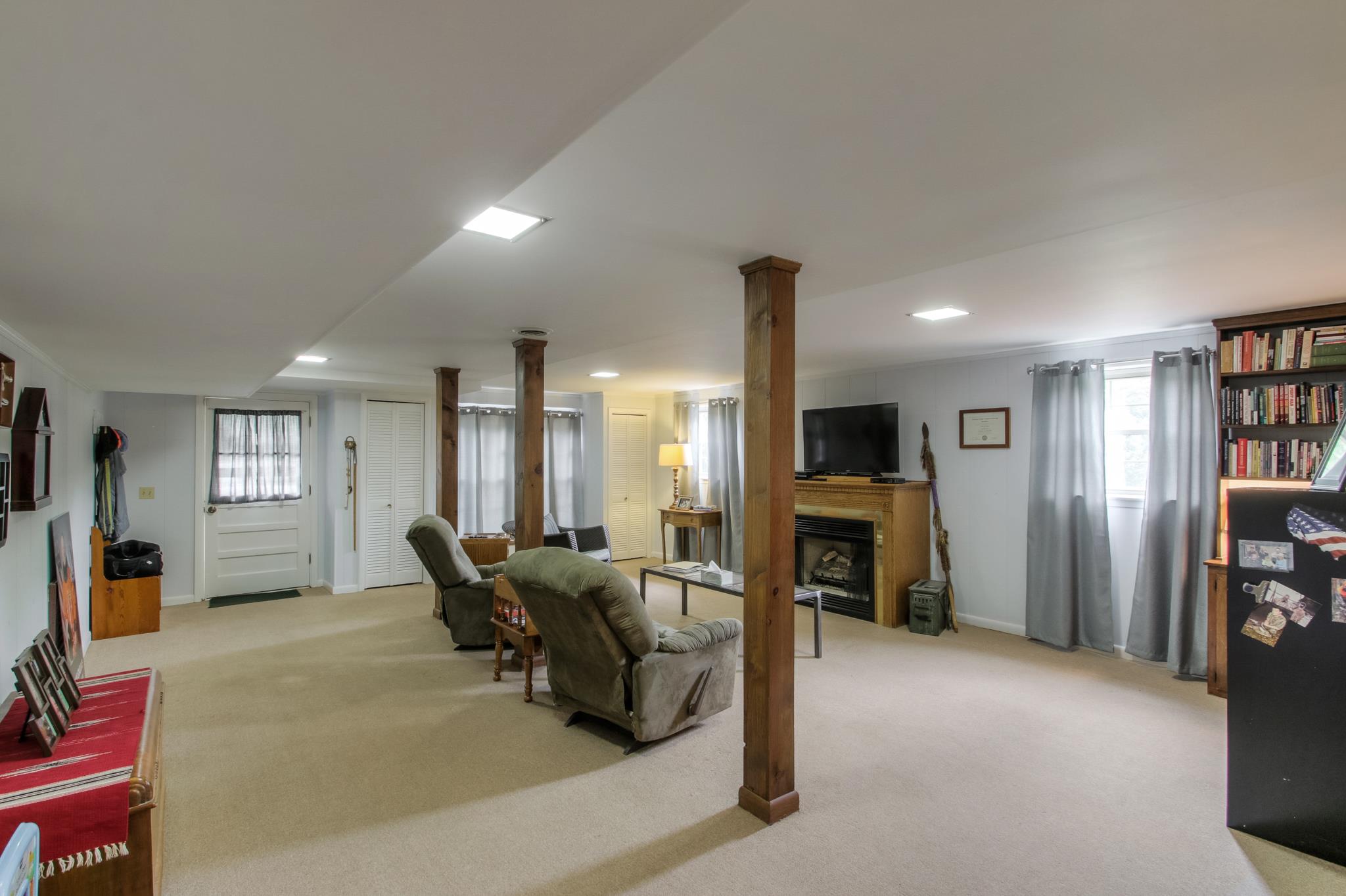 1160 Vanderbilt Road Mount Juliet, TN 37122 - Photo 20 of 28 a living room with furniture flat screen tv and a fireplace