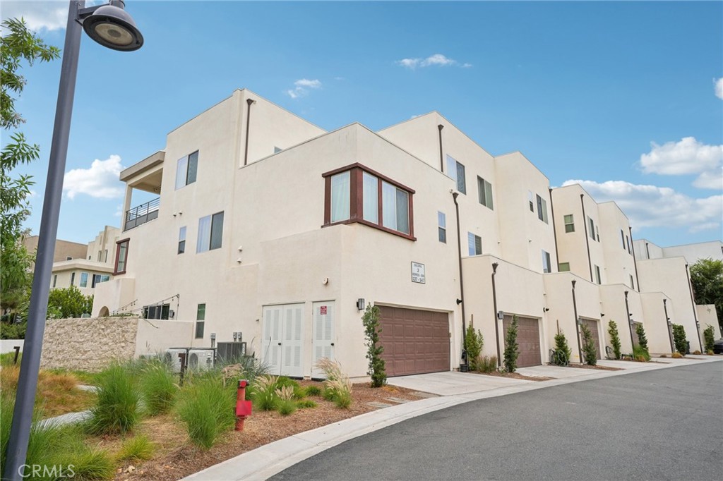 143 Frame Irvine, CA 92618 - Photo 30 of 41 a front view of a building with many windows